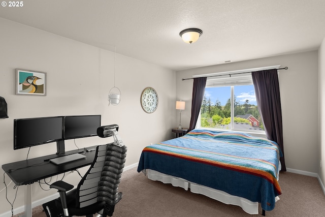 carpeted bedroom featuring baseboards and visible vents