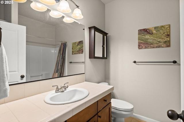 full bathroom with vanity, toilet, tile patterned floors, curtained shower, and tasteful backsplash