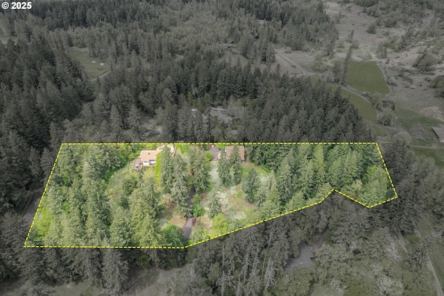 bird's eye view featuring a forest view