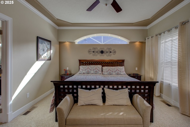 bedroom featuring multiple windows, ensuite bath, ornamental molding, and ceiling fan