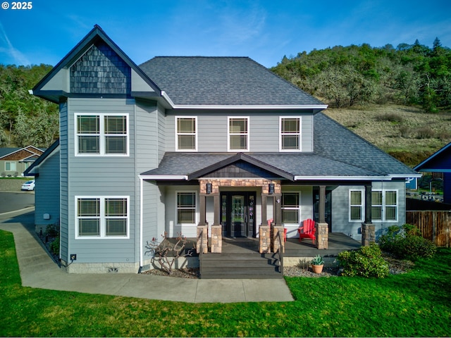 459 Oak Valley Loop, Winchester, OR 97495 - rear view of house with roof with shingles, a yard, and a porch