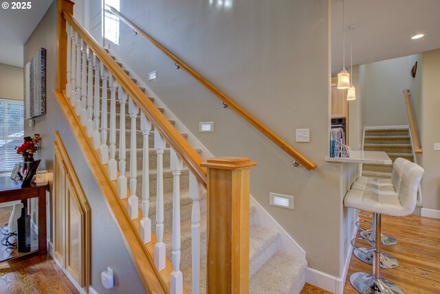 459 Oak Valley Loop, Winchester, OR 97495 - staircase featuring wood finished floors and recessed lighting