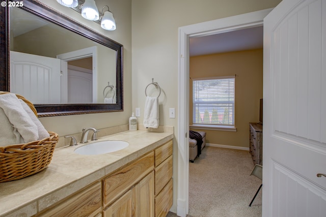 bathroom with tile patterned flooring, vanity, and toilet