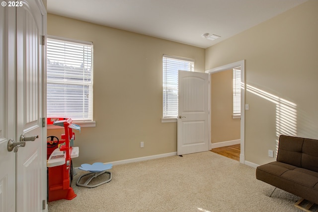 corridor featuring light hardwood / wood-style floors