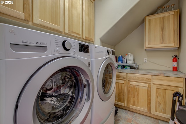 459 Oak Valley Loop, Winchester, OR 97495 - washroom with independent washer and dryer, cabinet space, and light tile patterned flooring