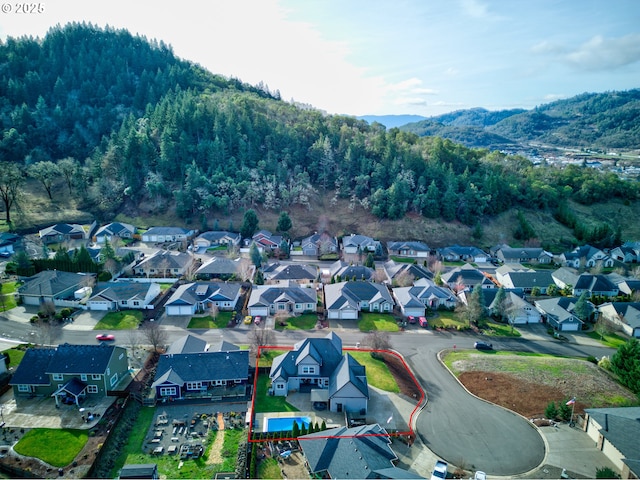 459 Oak Valley Loop, Winchester, OR 97495 - aerial view of residential area with property parcel outlined and mountains