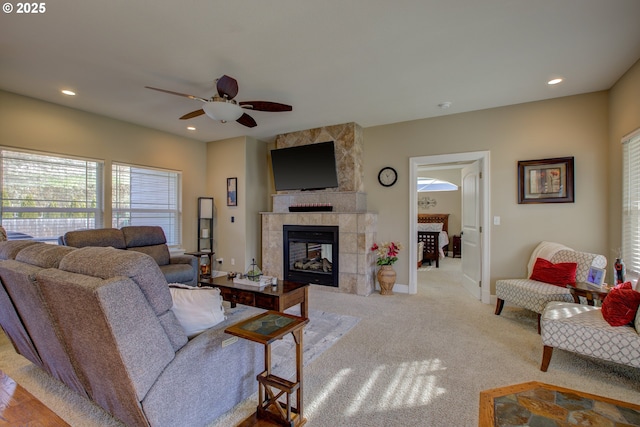 459 Oak Valley Loop, Winchester, OR 97495 - carpeted living area featuring a ceiling fan, a tiled fireplace, and recessed lighting
