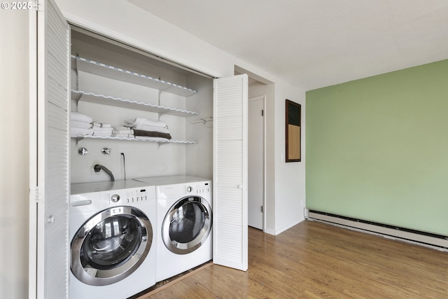 6125 SW Erickson Ave, Beaverton, OR 97008 - washroom with wood finished floors, a baseboard radiator, washing machine and clothes dryer, and baseboards