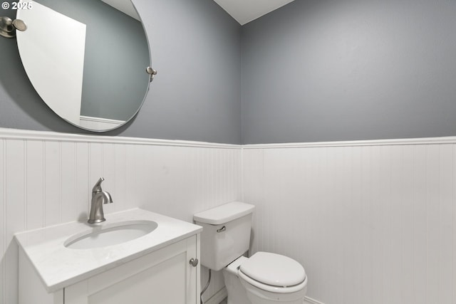6125 SW Erickson Ave, Beaverton, OR 97008 - half bath featuring a wainscoted wall, toilet, and vanity
