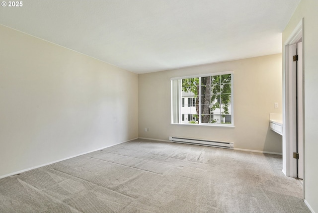 6125 SW Erickson Ave, Beaverton, OR 97008 - carpeted empty room with a baseboard radiator and baseboards