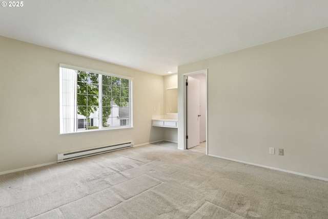 6125 SW Erickson Ave, Beaverton, OR 97008 - empty room with a baseboard radiator, light carpet, and baseboards