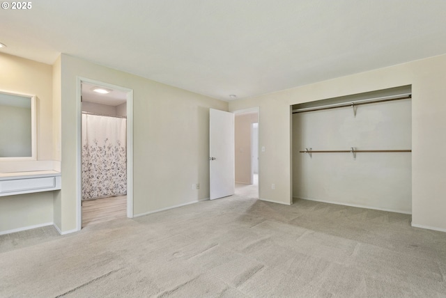 6125 SW Erickson Ave, Beaverton, OR 97008 - unfurnished bedroom featuring carpet flooring, a closet, connected bathroom, and baseboards