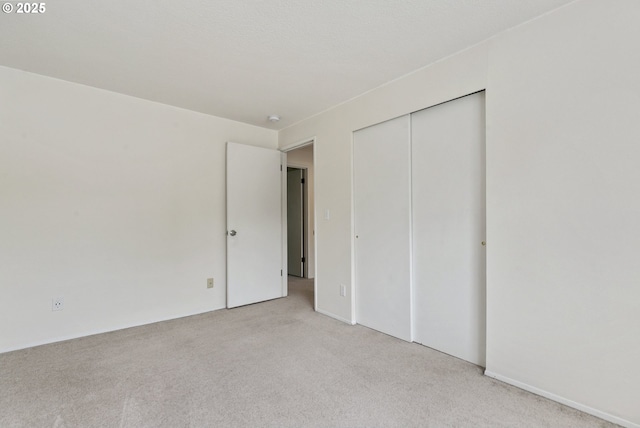 6125 SW Erickson Ave, Beaverton, OR 97008 - unfurnished bedroom featuring light carpet and a closet