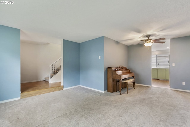 6125 SW Erickson Ave, Beaverton, OR 97008 - living area with carpet, a ceiling fan, stairway, and baseboards