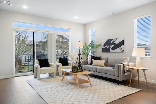 living room with light hardwood / wood-style flooring