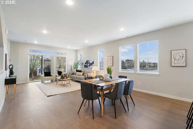 dining area featuring wood-type flooring