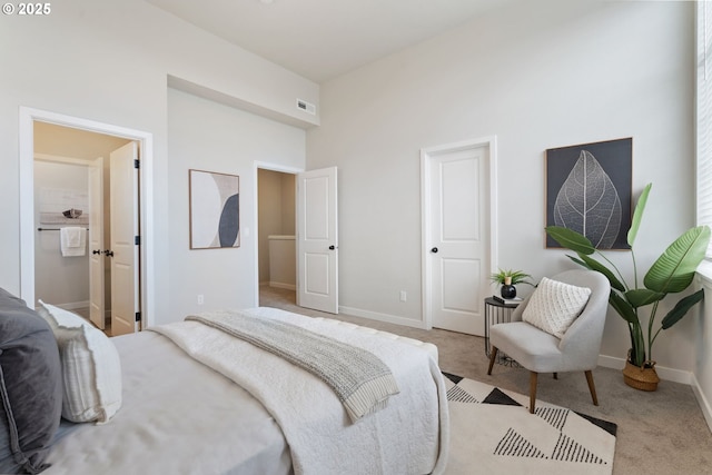 bedroom featuring light colored carpet