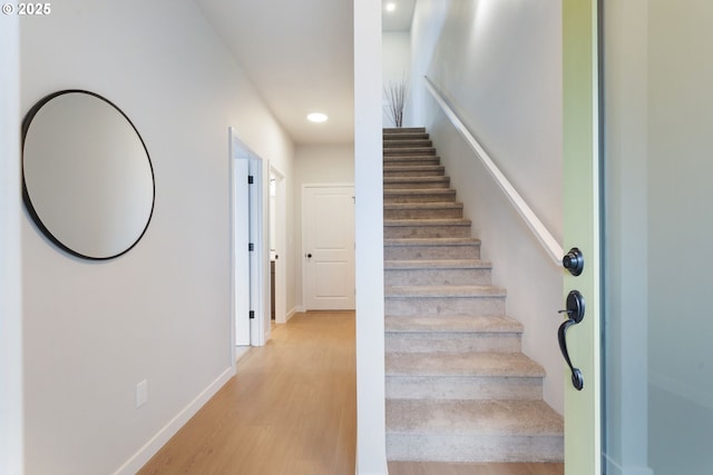 stairs with wood-type flooring