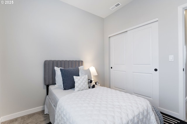 carpeted bedroom with a closet