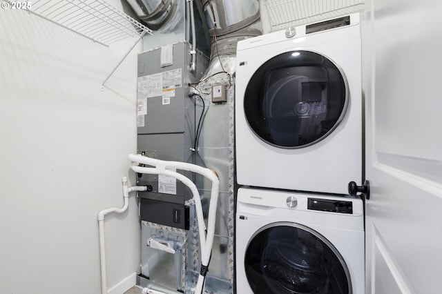 laundry area featuring stacked washer and clothes dryer