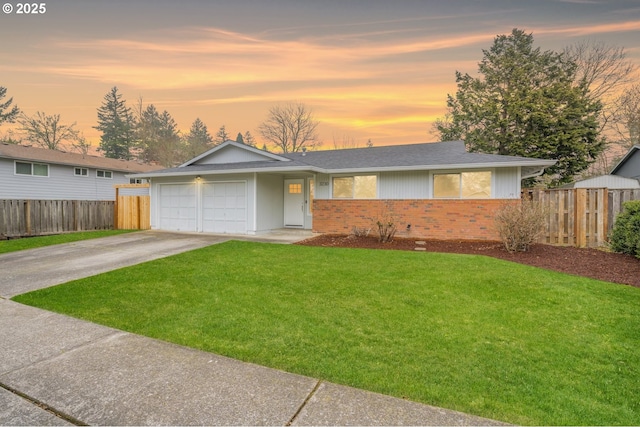 ranch-style home with a lawn and a garage