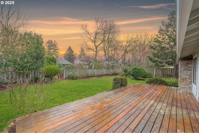 deck at dusk with a lawn