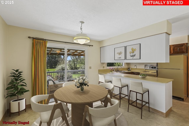 dining area with a textured ceiling