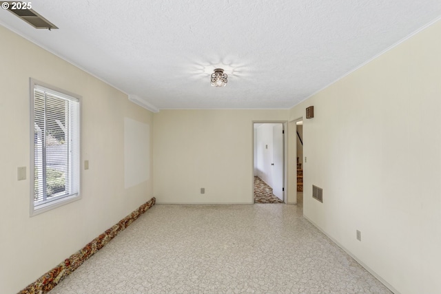 below grade area with carpet flooring and a textured ceiling
