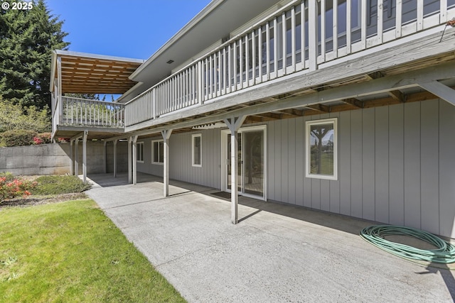 rear view of property with a patio area and a wooden deck