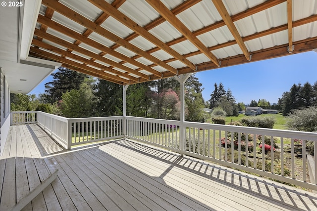 deck featuring view of scattered trees