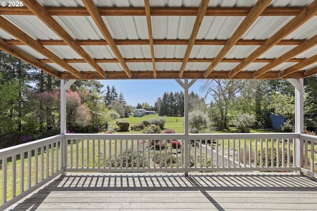 deck featuring view of wooded area