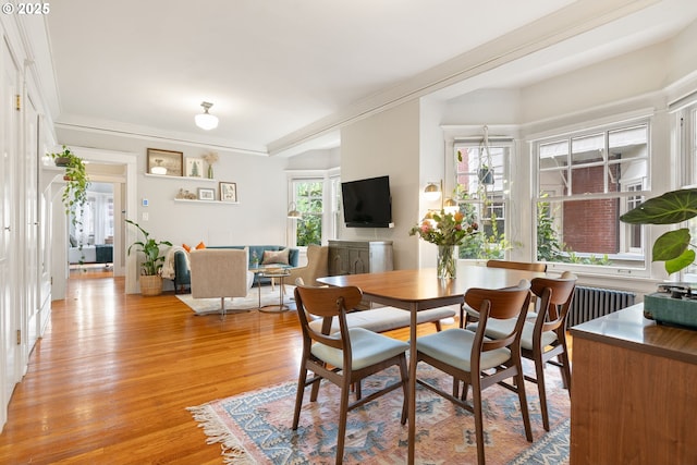 2083 NW Johnson St Unit 34, Portland, OR 97209 - dining area featuring light wood-type flooring and radiator heating unit