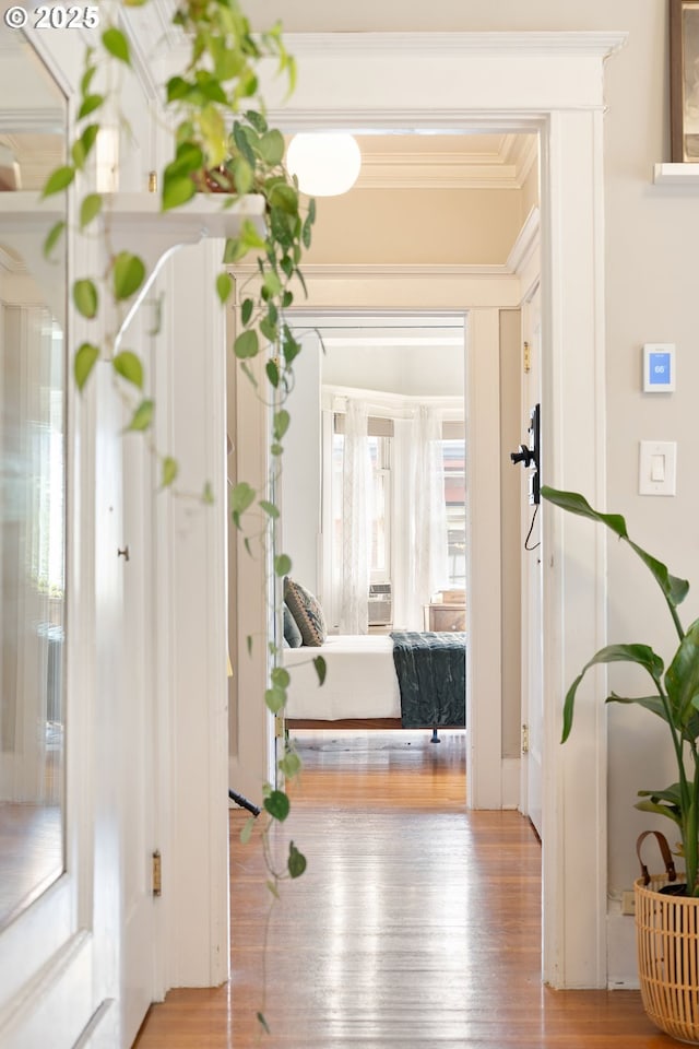 2083 NW Johnson St Unit 34, Portland, OR 97209 - hallway featuring ornamental molding and wood finished floors