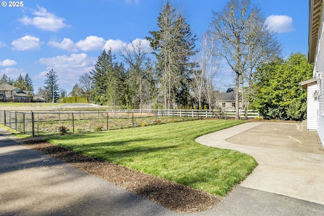 view of yard featuring a patio and fence