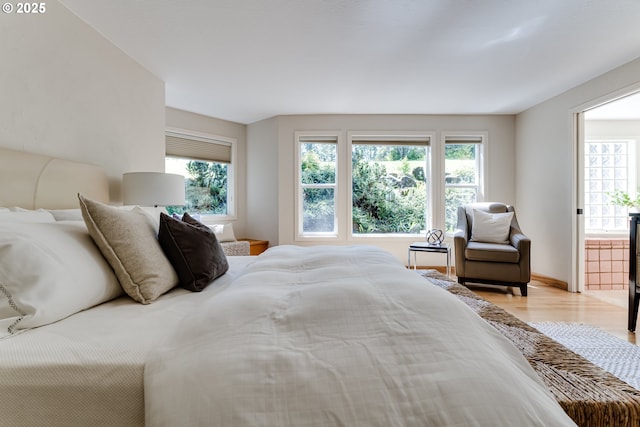 bedroom featuring light wood-style floors