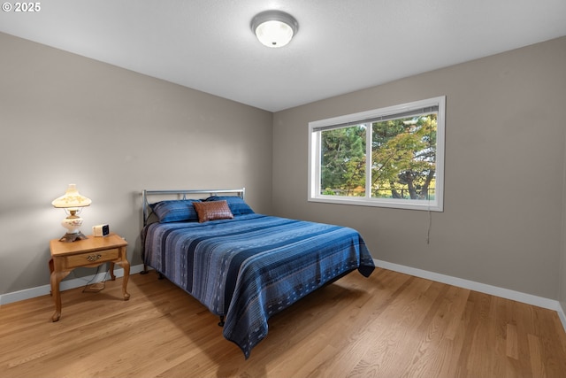 89523 Manion Dr, Warrenton, OR 97146 - bedroom featuring baseboards and light wood-style flooring