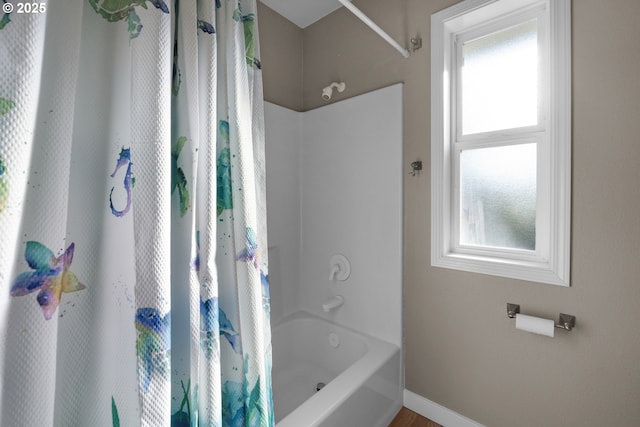 89523 Manion Dr, Warrenton, OR 97146 - bathroom featuring healthy amount of natural light and shower / bathtub combination with curtain