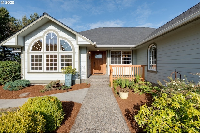 89523 Manion Dr, Warrenton, OR 97146 - entrance to property featuring covered porch and a shingled roof
