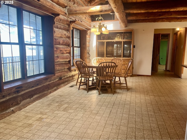 29202 Wallace St, Gold Beach, OR 97444 - dining space featuring beamed ceiling, visible vents, and an inviting chandelier