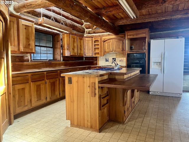 29202 Wallace St, Gold Beach, OR 97444 - kitchen with white fridge with ice dispenser, black oven, open shelves, light floors, and wooden ceiling