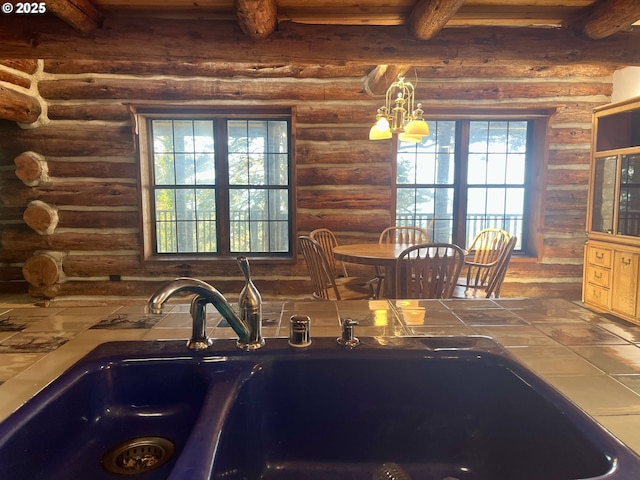 29202 Wallace St, Gold Beach, OR 97444 - kitchen featuring a sink, tile counters, beam ceiling, and a notable chandelier
