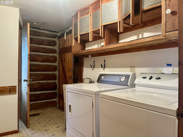 29202 Wallace St, Gold Beach, OR 97444 - washroom featuring light floors, washer and dryer, laundry area, and rustic walls