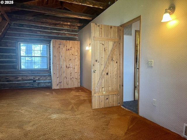 29202 Wallace St, Gold Beach, OR 97444 - interior space with wallpapered walls, lofted ceiling with beams, visible vents, and carpet floors