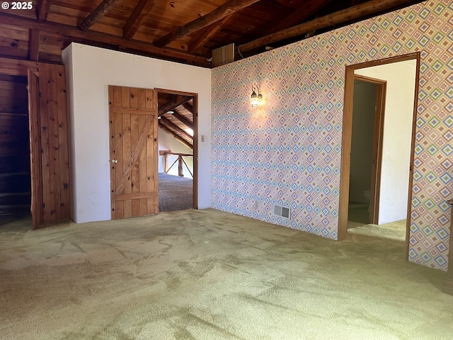 29202 Wallace St, Gold Beach, OR 97444 - unfurnished room featuring visible vents, wooden ceiling, beam ceiling, wallpapered walls, and carpet flooring