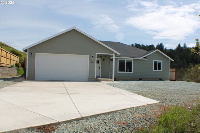 ranch-style house with concrete driveway, an attached garage, a shingled roof, and fence