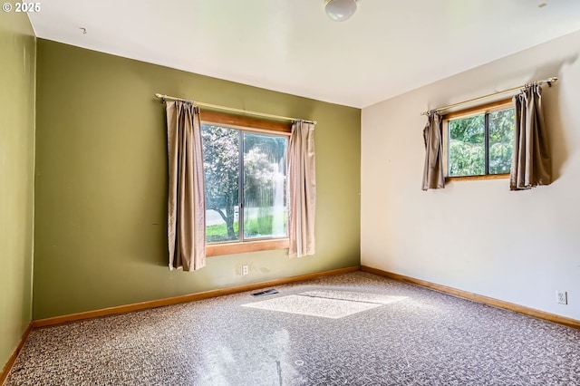 819 Oak St, Silverton, OR 97381 - carpeted spare room with plenty of natural light, baseboards, and visible vents
