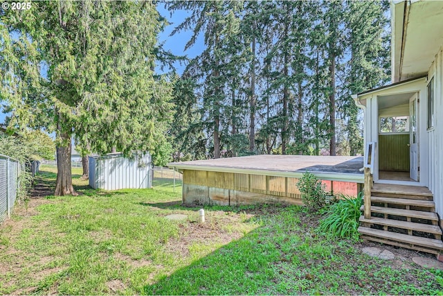 819 Oak St, Silverton, OR 97381 - view of yard with an outdoor structure, a shed, and fence