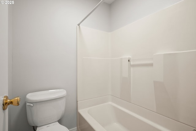 bathroom with toilet and bathtub / shower combination