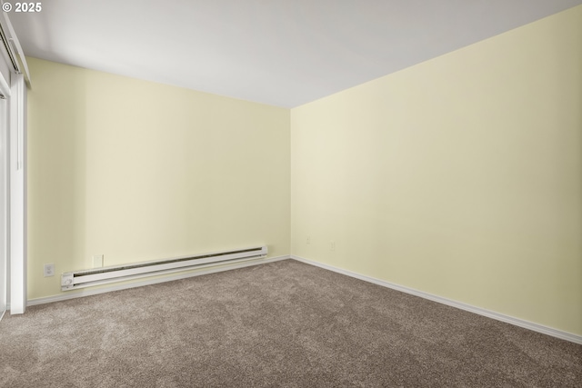 empty room featuring a baseboard radiator and carpet