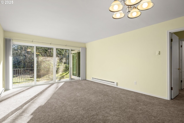 carpeted empty room featuring a baseboard radiator and a notable chandelier